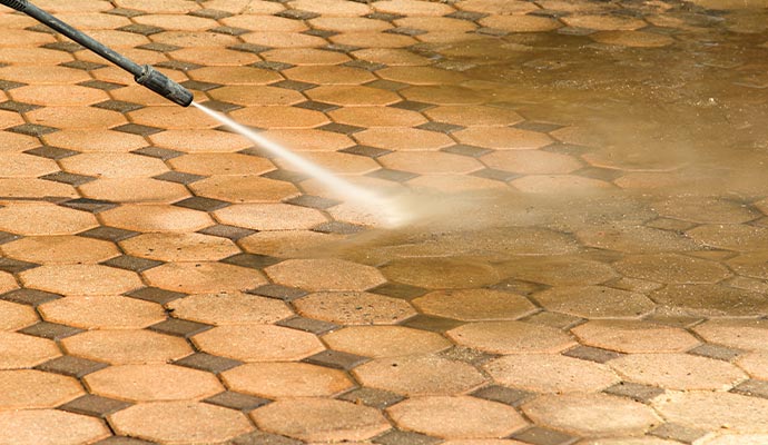 Cleaning floor with pressure washing