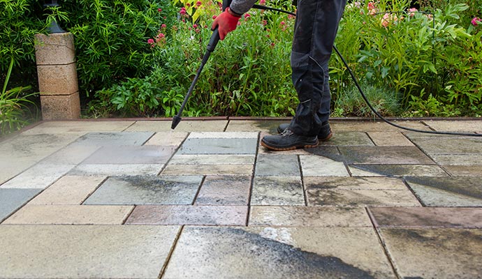 Professionals cleaning the floor with pressure washing