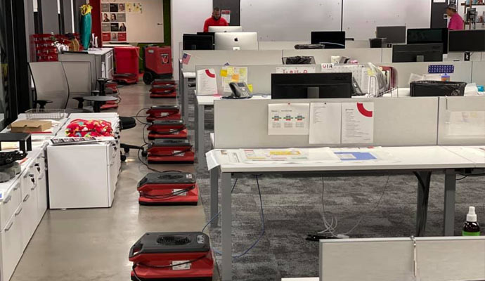 Water damaged carpet drying in the office